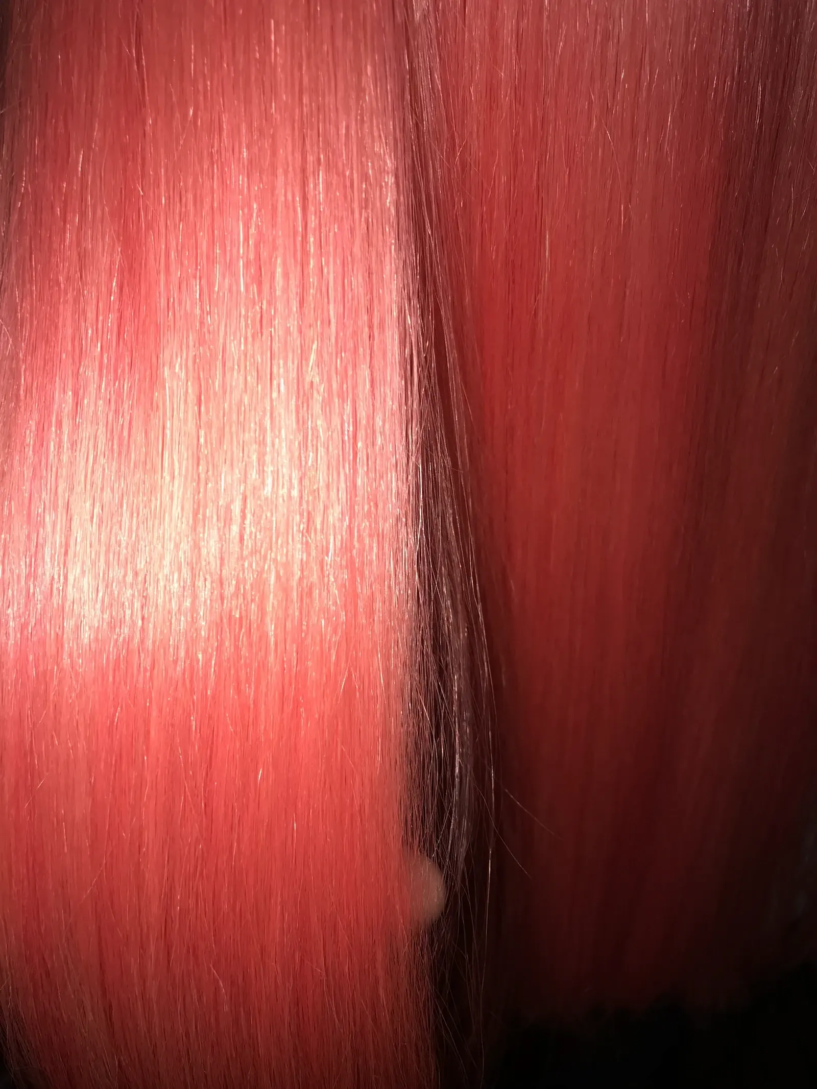 Close detail of glossy vivid red hair colour